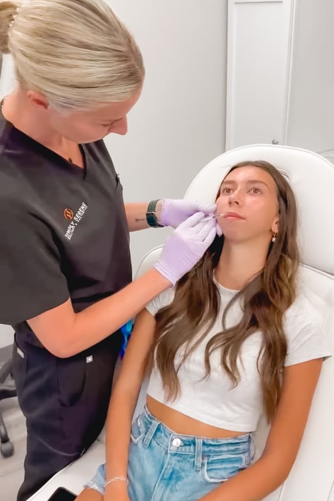 A Female getting injection on lips | Dermal Fillers in St. Cloud, MN | Simply Serene Wellness and Aesthetics