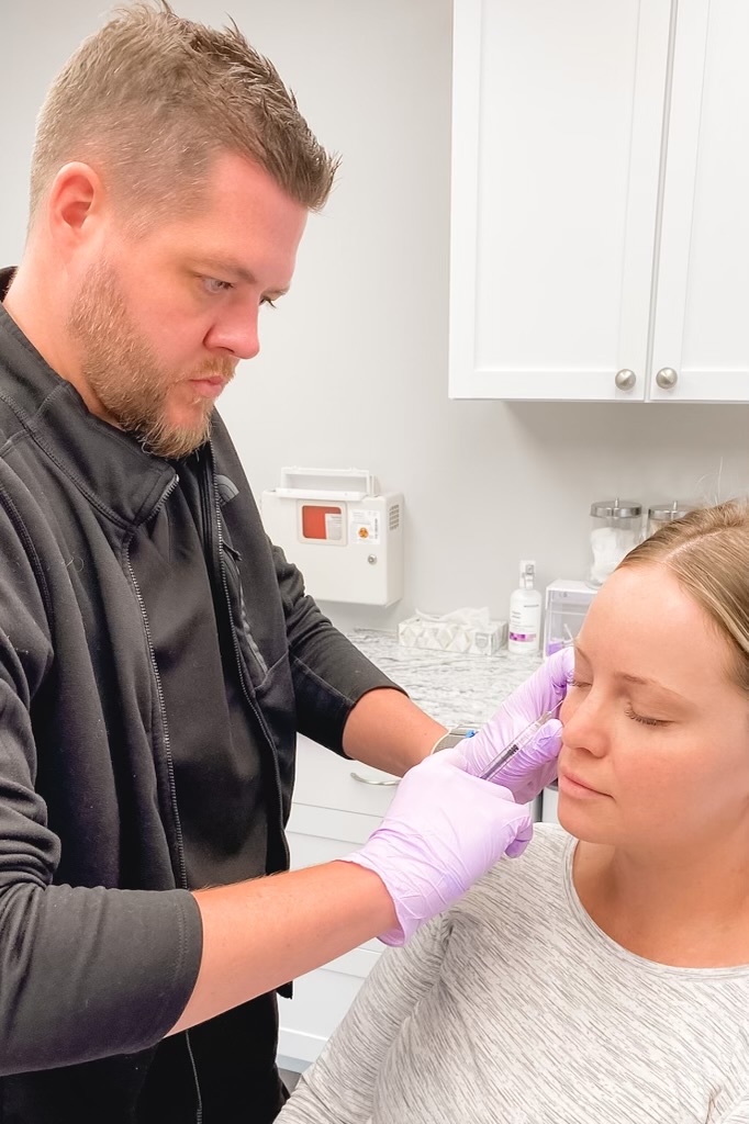 A Female getting injection on cheeks | Sculptra and Radiesse in St. Cloud, MN | Simply Serene Wellness and Aesthetics